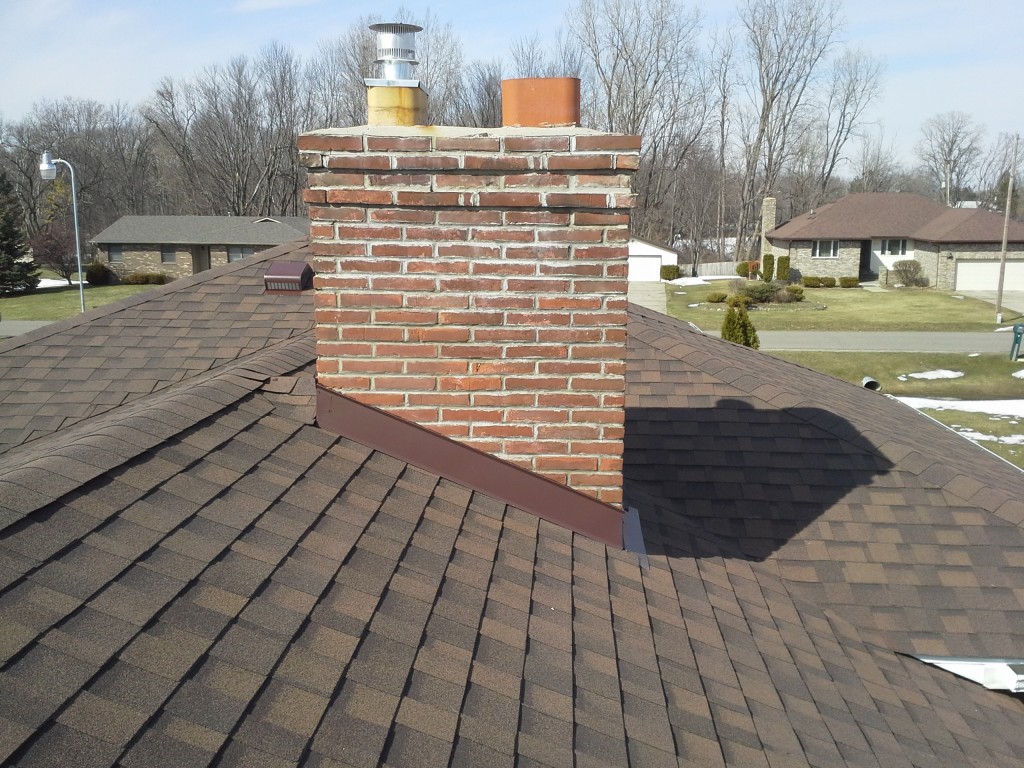 Chimney with flashing and vent